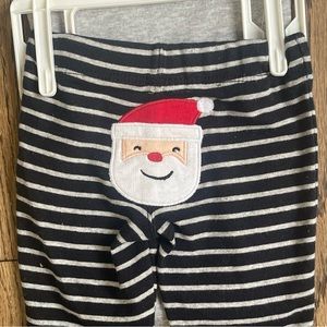 Carters two piece set. Santa’s little helper. New Born. New With Tags.
